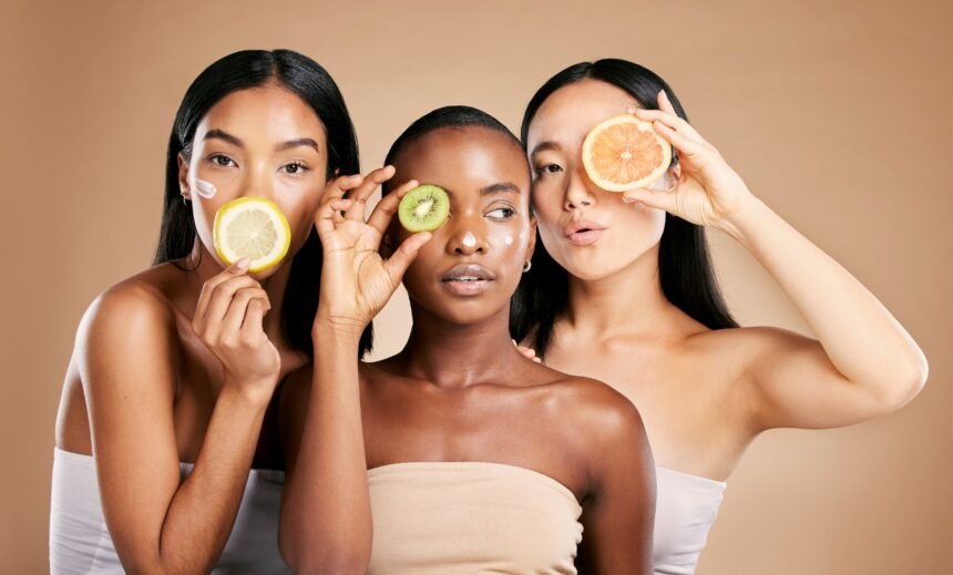 Webstory - alimentos e pele  NAO UTLIZAR APOS A DATA  DA PUBLICAÇÂO  EM CASO DE DUVIDA FALAR COM A FOTOGRAFIA Skincare, diversity and women with fruit, cosmetics and dermatology with friends on brown studio background. Face, vitamin c or ladies with natural beauty, girls and nutrition with healthy lifestyle.